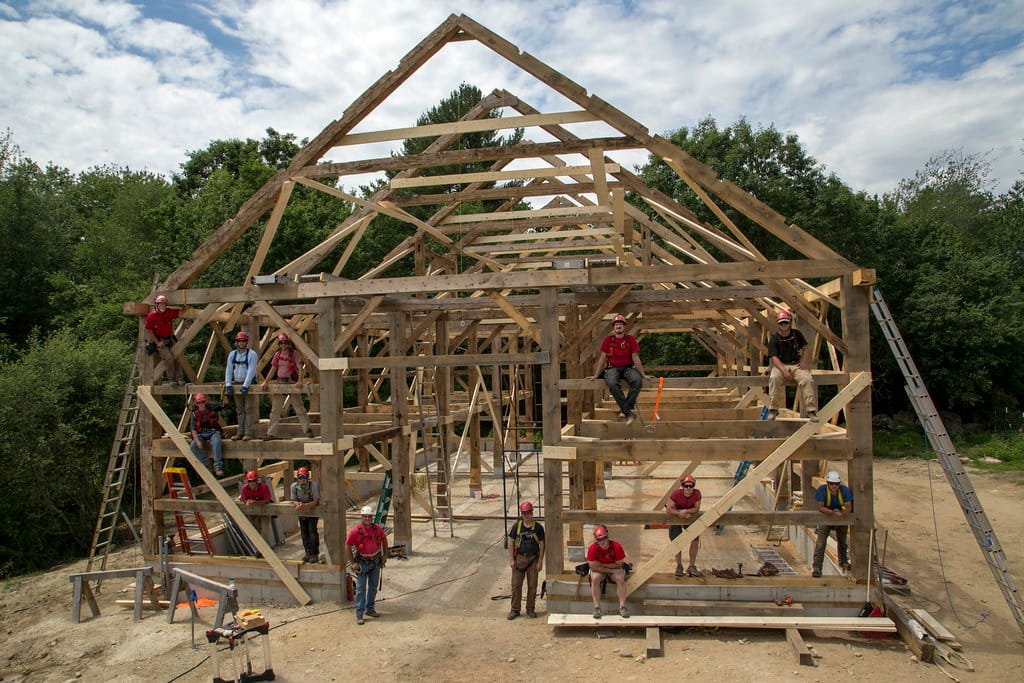 The crew celebrate a barn raising
